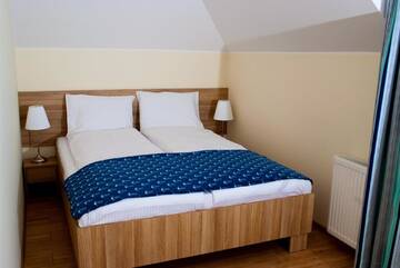 Фото номера Апартаменты с видом на озеро Апарт-отели Apartamenty Kapitanskie г. Илава 8